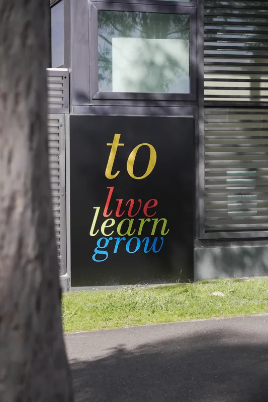 Woodstock Early Learning Centre sign reading “to live, learn, grow” on the building