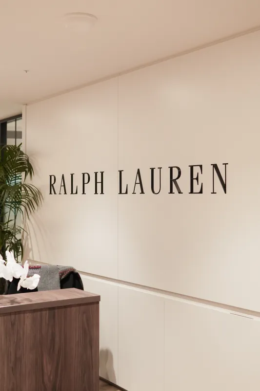 Ralph Lauren sign on a white wall at the Ralph’s Coffee shop
